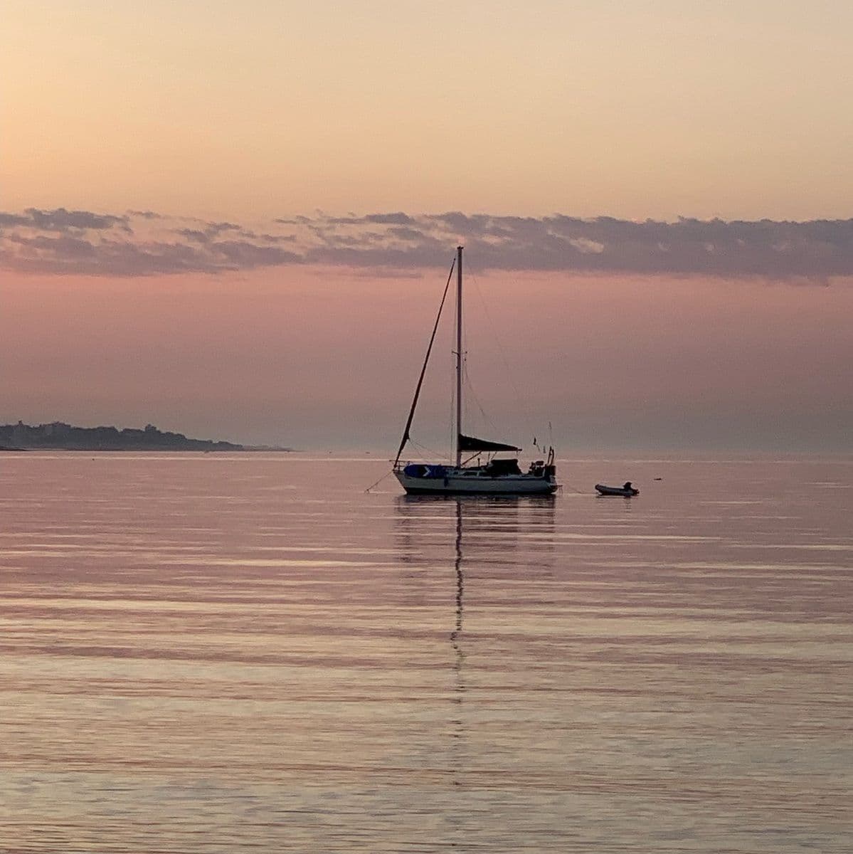 Archive photograph: Sunrise with a sailboat. (Jackie Sheridan)